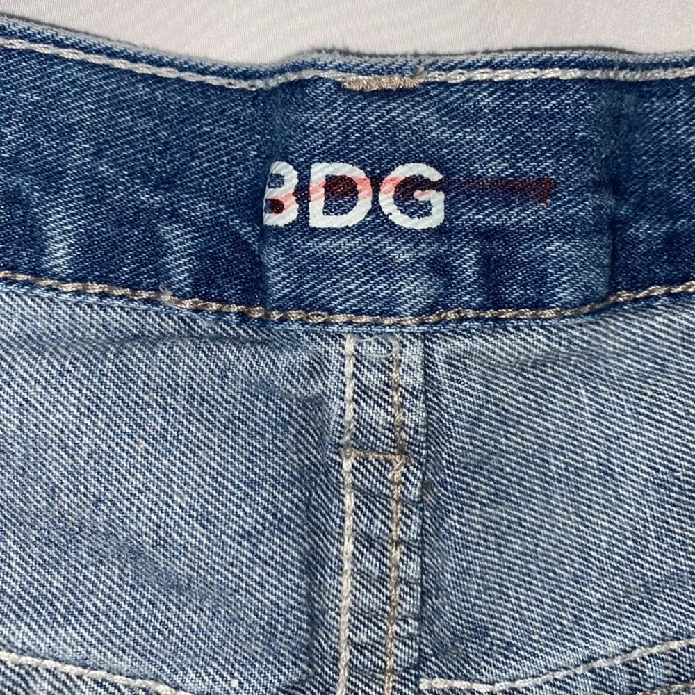BDG High Rise Button Fly Distressed & Patched Tomgirl Jean Shorts